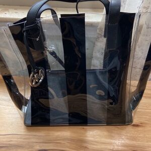 Michael Kors Black and Transparent Tote with black MK zip case.